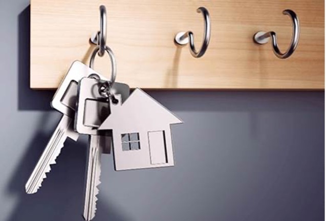 A set of keys hanging on a key rack